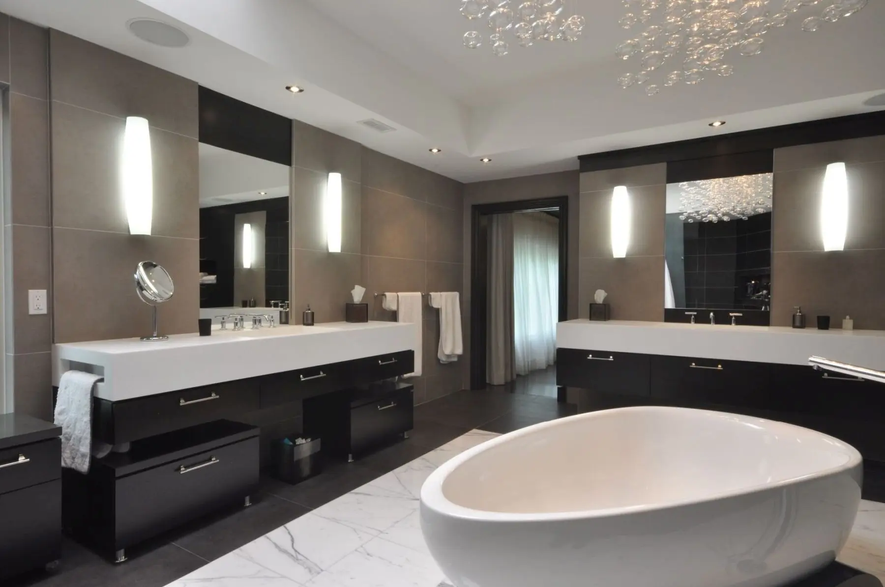 Custom bathroom vanity with dual sinks and modern lighting, designed by Homestead Woodworks for a luxurious and functional bathroom